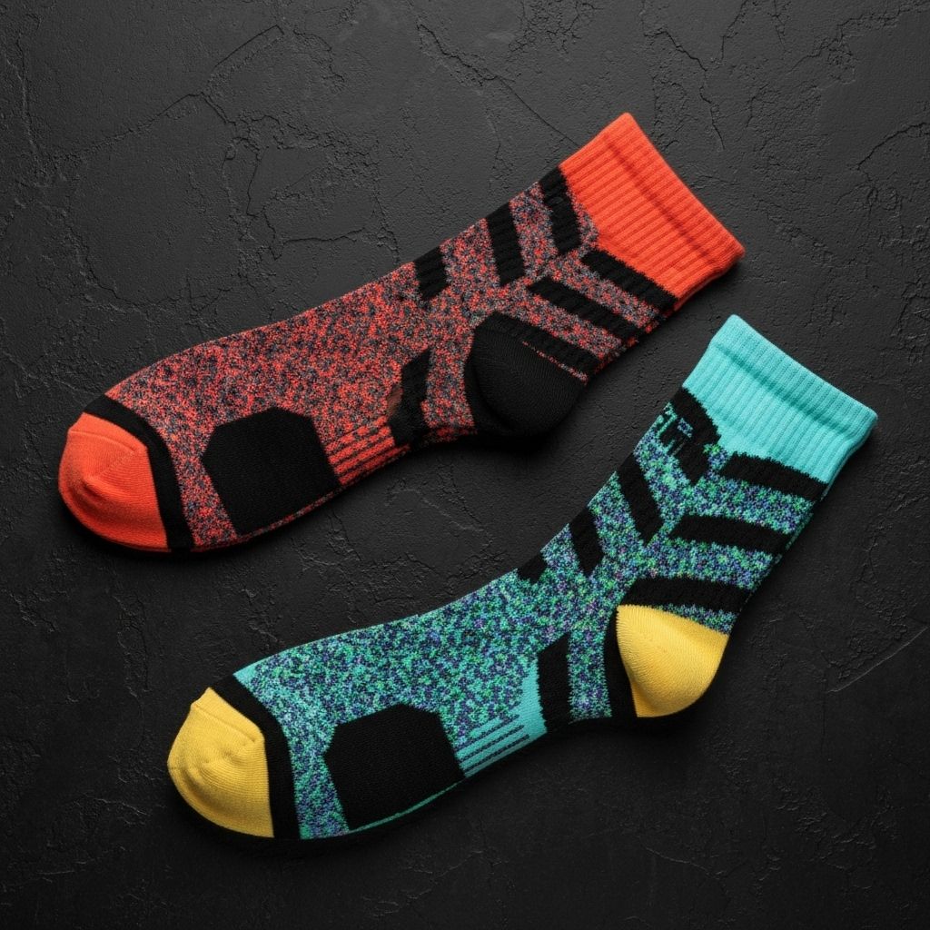 Close-up of Skateboarding athlete legs wearing custom team socks on field